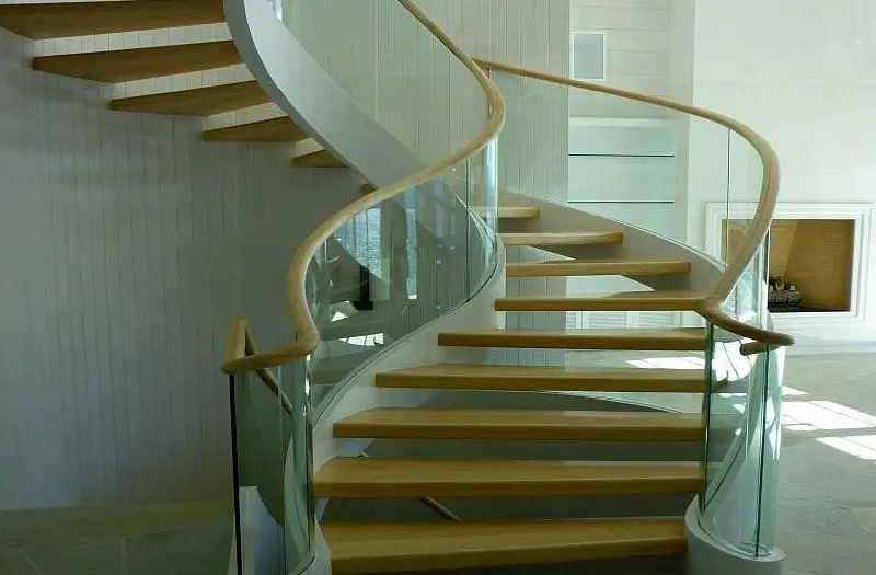 A spiral glass staircase railing